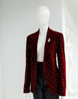 A lipstick red, soaked velvet peak lapel suit with black mikado pencil pant.