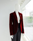 A lipstick red, soaked velvet peak lapel suit with black mikado pencil pant.