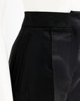 A black mikado pencil cut pant.