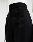 A black mikado pencil cut pant.