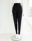 A black mikado pencil cut pant.