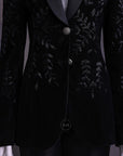 A Charcoal black velvet shawl lapel suit with floral ceramic beads detailing & pencil cut silk pant.