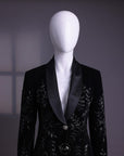 A Charcoal black velvet shawl lapel suit with floral ceramic beads detailing & pencil cut silk pant.