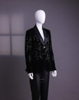 A Charcoal black velvet shawl lapel suit with floral ceramic beads detailing & pencil cut silk pant.