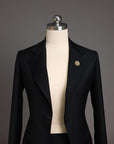 A Charcoal black notch lapel suit with skirt.