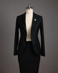 A Charcoal black notch lapel suit with skirt.