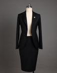 A Charcoal black notch lapel suit with skirt.